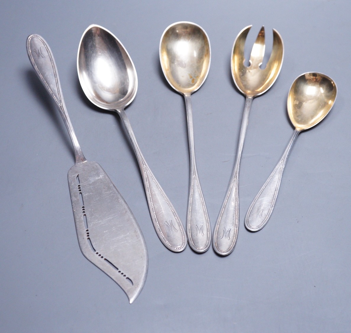 Five items of German 800 standard flatware including a pair of salad serves and a fish slice